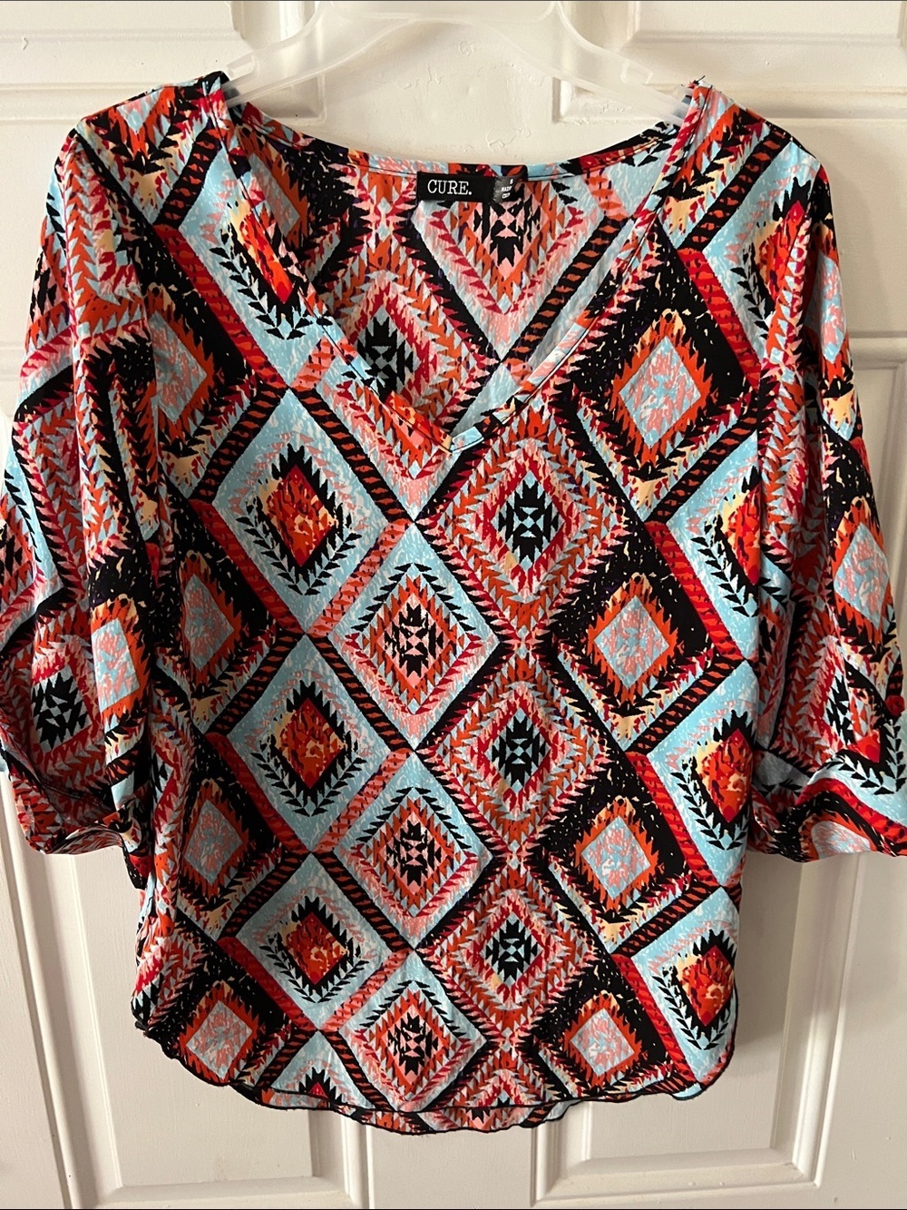 CURE Women's Red & Light Blue Geometric V-Neck Blouse